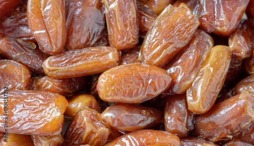 Close up photo of ripe pitted dates, selective focus.