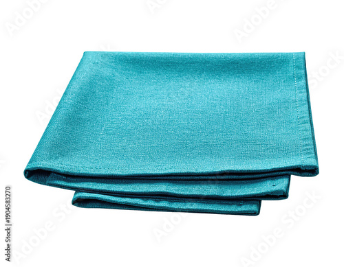 Folded turquoise cloth napkins, stacked neatly on a dark background