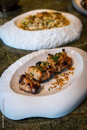 Grilled chicken skewers with sauce  close-up