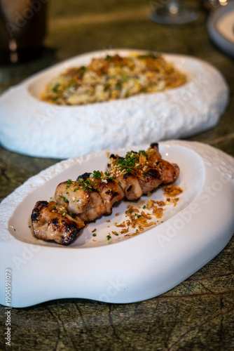 Grilled chicken skewers with sauce  close-up
