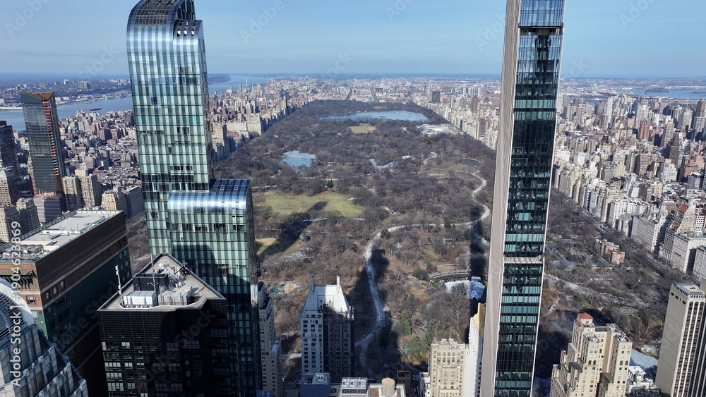 Obraz premium Central Park In Manhattan New York United States. Aerial View Of Green Space Surrounded By Lush Forest Trees. Business Sky Downtown Cityscape. Business Downtown Panorama. Manhattan New York.