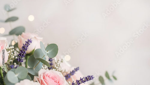 Beautiful bouquet of pink roses and lavender flowers with eucalyptus leaves on white background
