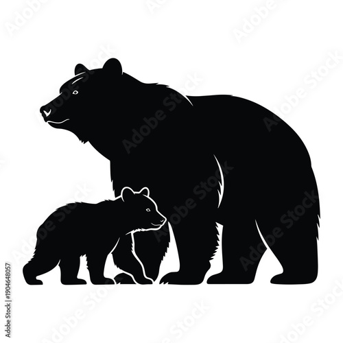 Mother bear and cub walking together in silhouette