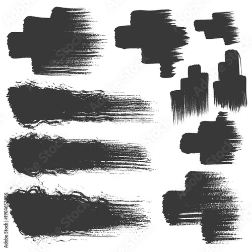 Various black brush strokes on a white background