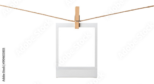 Foto Blank instant photo frame PNG isolated on transparent background, hanging from a