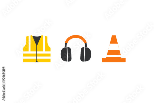 Safety gear for workers includes a vest, headphones, and traffic cone at a construction site during the day