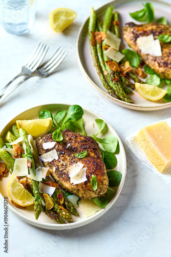 Baked chicken breast with green asparagus and parmesan