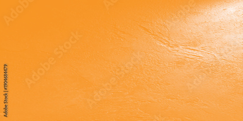 A blank vintage background featuring a rough textured old paper and aged brown wall pattern with a grunge orange and yellow grain surface