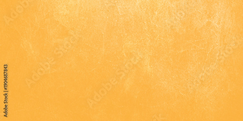 Vintage aged wood texture background featuring natural brown patterns and a stained grunge parchment surface with an antique orange glow