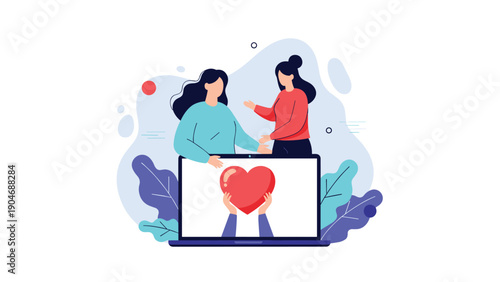 Two women collaborating and looking at a laptop screen that shows a heart being held by two hands to represent shared online charity work.