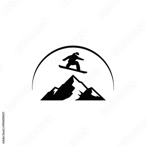 Silhouette of a snowboarder leaping over rugged mountains beneath a rising sun.