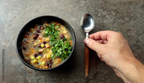 Obraz na plátně Red bean soup with potatoes, tomatoes, paprika, carrot, and bacon