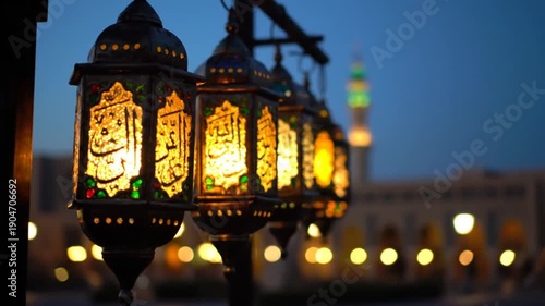 Illuminated Lanterns in Front of Mosque at Night.