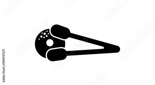 Simple black golf ball marker with clip on white background.