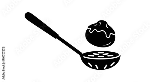 Black and white illustration of a frying pan and egg.