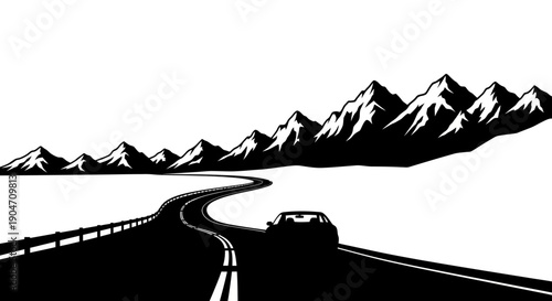 Car driving on winding mountain road with stunning snow-capped peaks