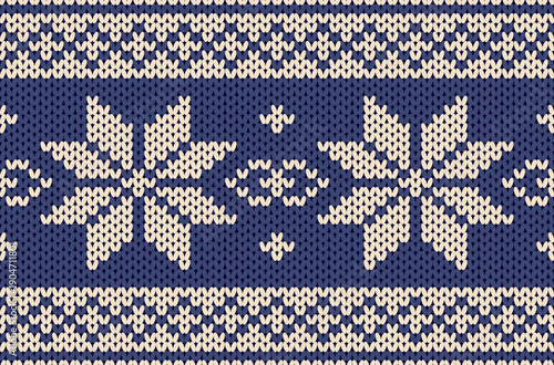 Deep blue knitted yarn pattern with a Christmas floral theme.