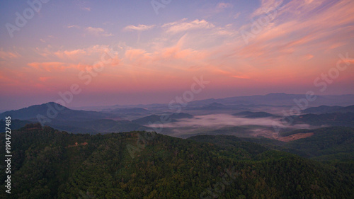 Aerial view scenery sweet sunrise at Samet Nang Chee viewpoint in Phang Nga. Beautiful sunrise tropical landscape background.The flare light from the sun shines down on the islands.sweet sky