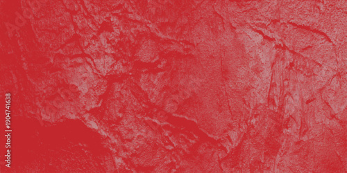 A vibrant red and pink grunge paint texture creates an aged, rough art design on a vintage cement wall surface with a dirty paper material pattern