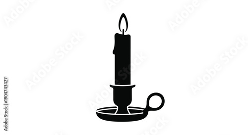 A simple black candle in a holder stark silhouette