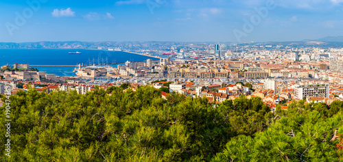 Panoramic aerial view od Marseille old port and its Mediterranean coastline; famous travel landmark city skyline of Marseille, Provence, France