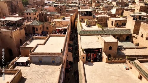 Aerial view of traditional Moroccan medina with ancient buildings and green tiled roofs in