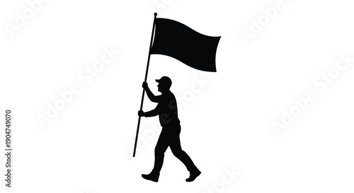 A person proudly carries a black flag in a striking silhouette
