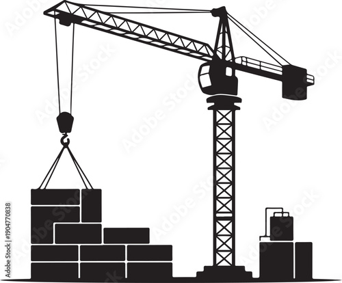 A heavy duty tower crane lifting large building blocks at a construction site with other materials