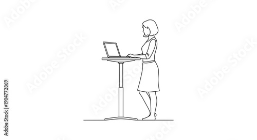 A professional woman stands attentively at a high desk, actively working on her laptop in an ergonomic and modern office setup.