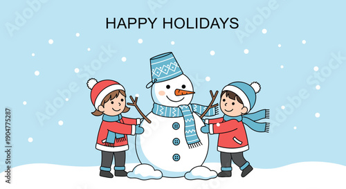 Two happy children in winter clothes building a snowman outdoors during a snowy day with happy holidays greeting text.