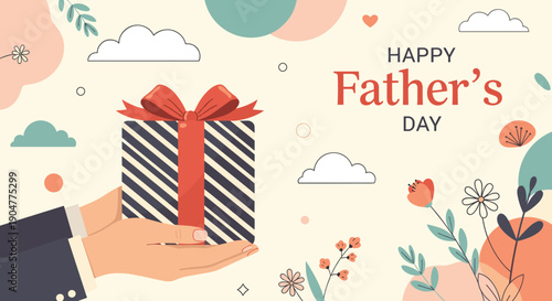 Person holding a striped gift box with a red bow as a present for happy father's day surrounded by floral decorations.