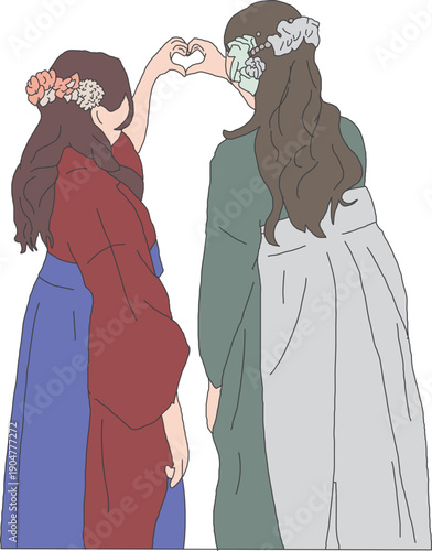 ハートを作る卒業式の袴を着た女性