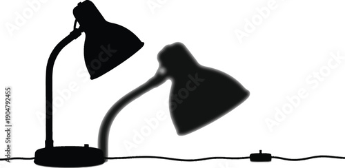 A desk lamp casting a distinct shadow is shown in stark silhouette indicating study or illumination needs.