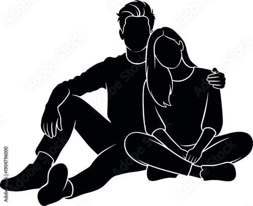 Silhouette of a romantic young couple sitting together on the floor embracing with love and affection for lifestyle and relationship concepts