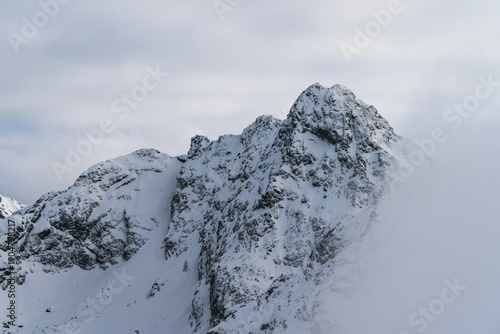 Billede på lærred Jagged winter mountain Swinica ridge on Kasprowy Wierch with sharp rocky summit