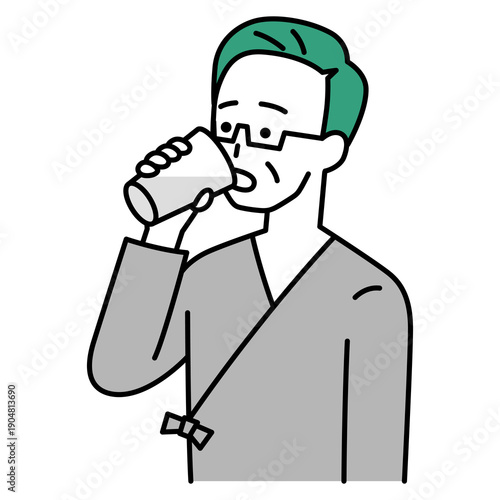 バリウムを飲む検査着の中年の男性