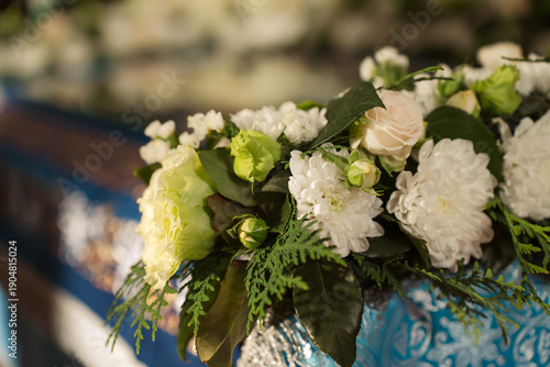 White and green flowers adorn Orthodox holiday of Assumption of the Virgin in church