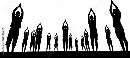 Large group of people practicing yoga in prayer pose silhouette
