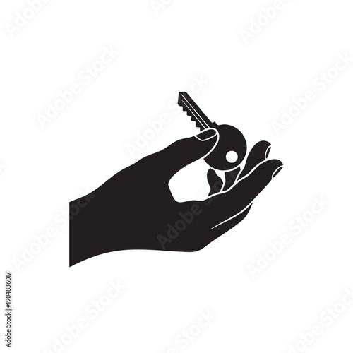 Silhouette of hand holding a key over palm with fingers gently closed symbolizing handover of ownership house keys or new beginning