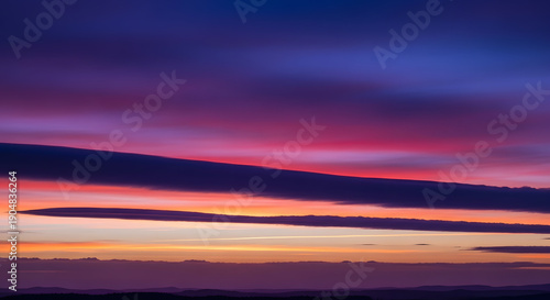 A vibrant sunset with colorful clouds in the evening sky