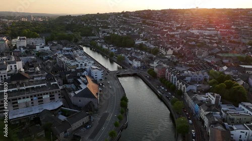 Evening glow over Cork city along the serene river Lee