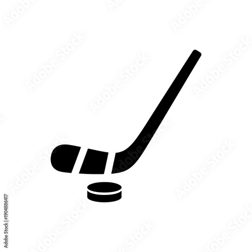 A black silhouette of a hockey stick and puck on a white background silhouette