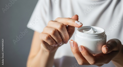 Skin cream is applied gently now for beauty