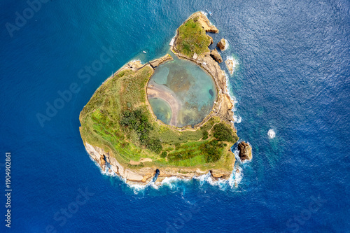 Azores aerial amazing view. Top view of Islet of Vila Franca do Campo. Crater of an old underwater volcano. San Miguel island, Azores, Portugal. Heart carved by nature. Bird eye view.