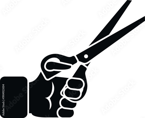 Hand holding pair of sharp scissors, representing hairdressing and barber tools