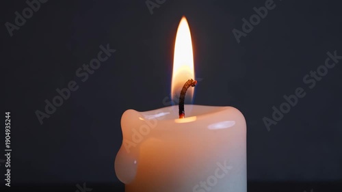 Wallpaper Mural Single candle flame burning in darkness closeup. Meditation light, peaceful ambiance, and spiritual relaxation footage Torontodigital.ca