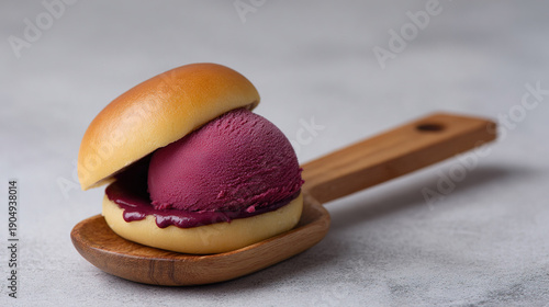 Delicious sandwich with purple ice cream on wooden plate