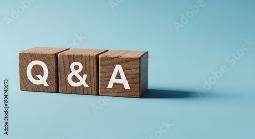 Q a wooden blocks on blue background for questions and answers