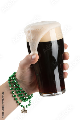 Festive st. patrick's day concept: a hand holding a pint of beer with green beads, ideal for party promotions, bar menus, and irish themes