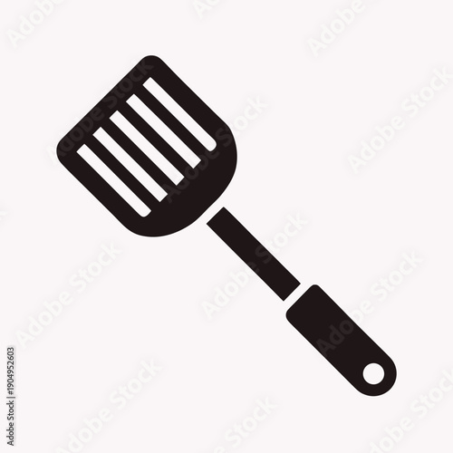Black silhouette icon of a slotted spatula on a white background kitchen utensil cooking tool